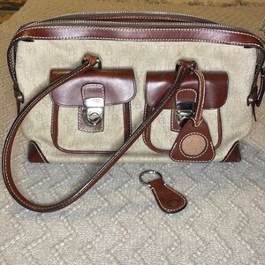 Dooney & Bourke Double Pocket Tote Purse in brown colored monogram.